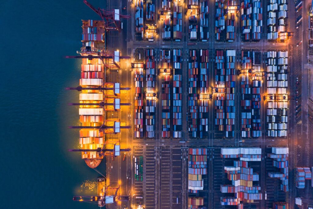 container cargo ship in the export and import business and logistics. Shipping to the harbor